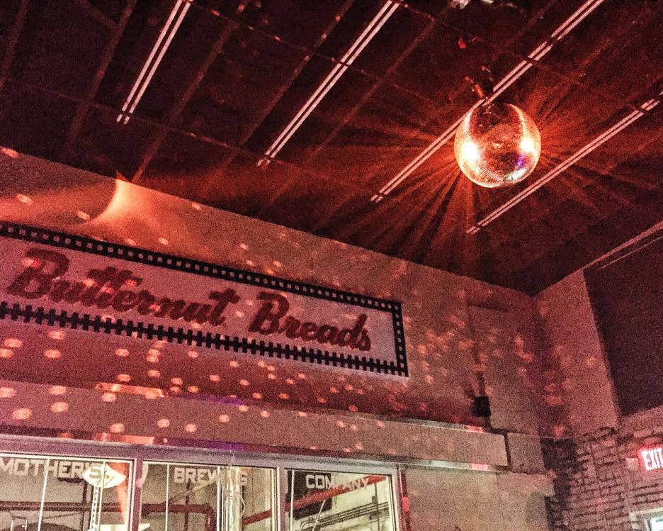 A disco ball hangs in the tasting room at Mother's Brewing Company