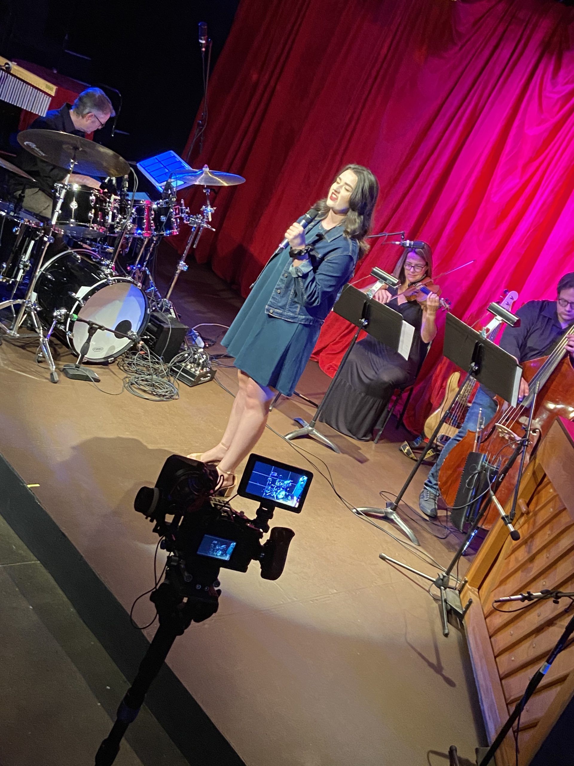 A woman sings on stage at Springfield Contemporary Theatre