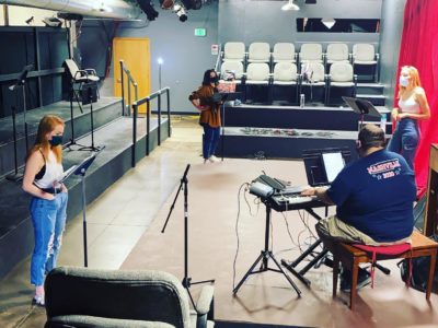 Three women sing and one man plays keyboard at Springfield Contemporary Theatre